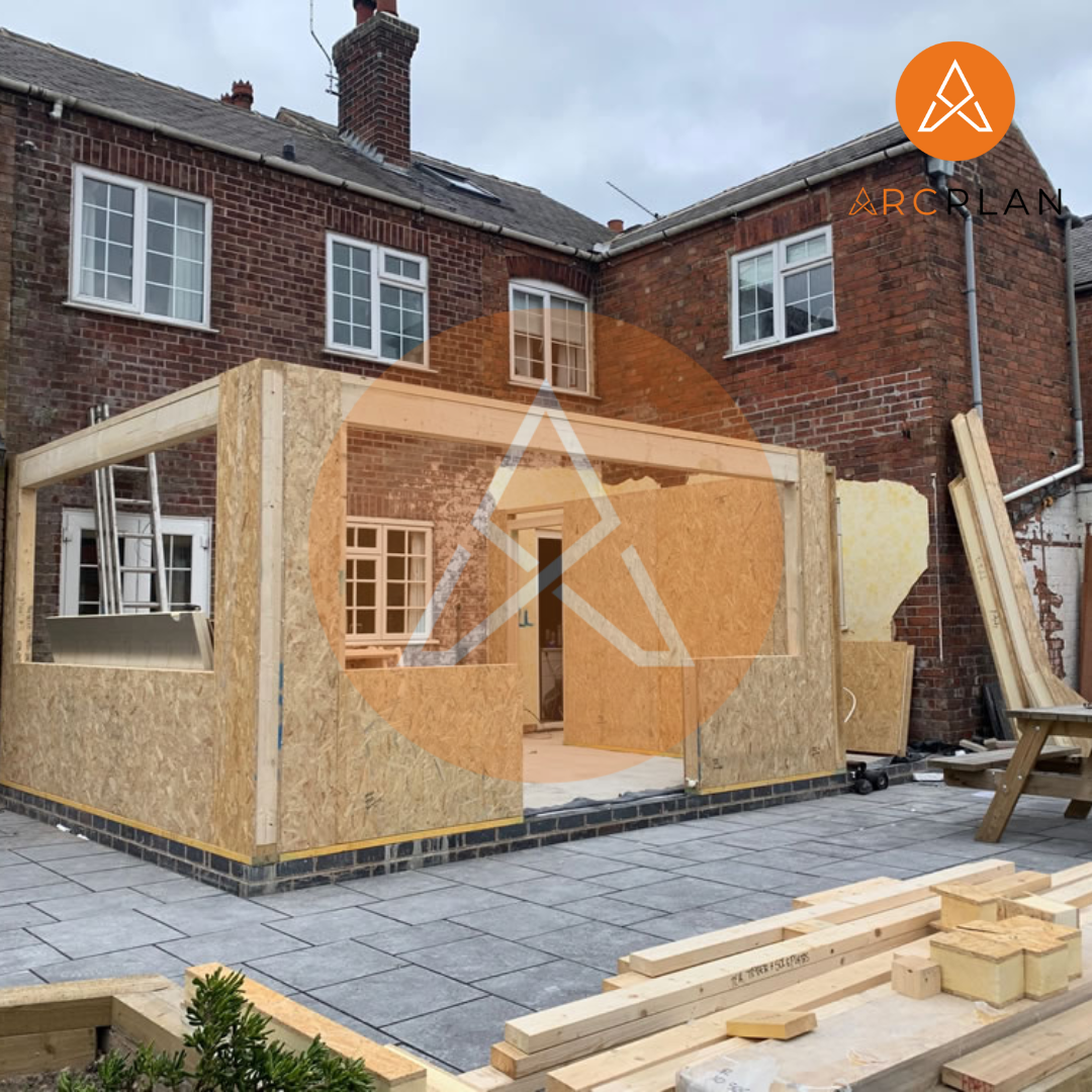 A house under construction extension works. the work is in the process of framing.